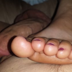 Tiny feet, on her man's meat, for you to beat.