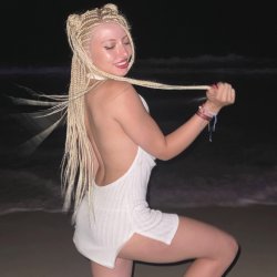 A playful goddess, glowing under the night sky