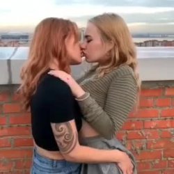 Lesbians kissing on rooftop
