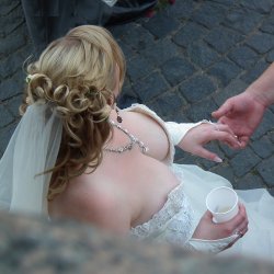 Huge Naturals being showed off in deep cleavage wedding dress