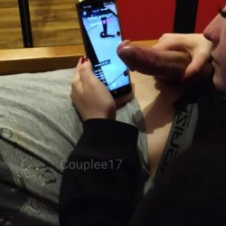 Scrolling through her phone with her man's "touch pen"