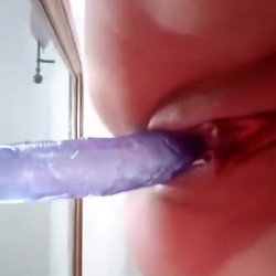 Slut gives a perfect view of her riding her purple dildo