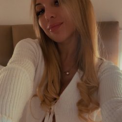 Smirk says tease… eyes say unwrap me