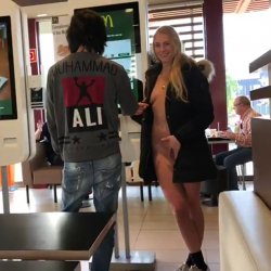 Young Swedish Tourist flashes the camera at an American McDonalds