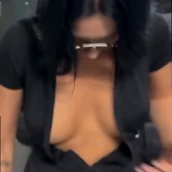She bends low showing cleavage and curves