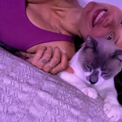 Cuddles, purrs with my cat 'cos I'm out of the office
