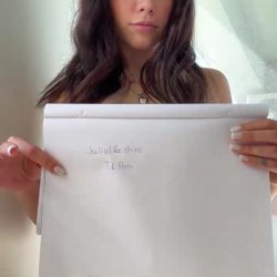 Nude curves teased as she holds the sign 💕